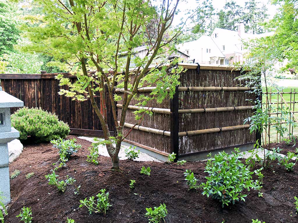 Bamboo fencing with wooden fence.